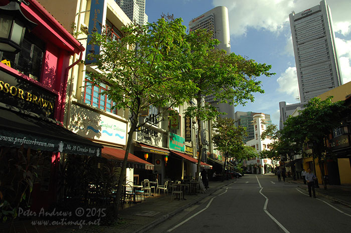 Circular Road runs right through one of the key restaurant and bar districts of Singapore at Boat Quay, Walking through late in the afternoon just before office workers descend from the towers of the banking, financial and other multinational business sectors that loom behind the classic shophouse buildings of Boat Quay, there is a sensation of the place just starting to come alive as it prepares for another busy evening of trade. Photo &copy; Peter Andrews / Outimage. Walking from Circular Road to Chinatown in Singapore as the city prepares for the Lunar New Year.