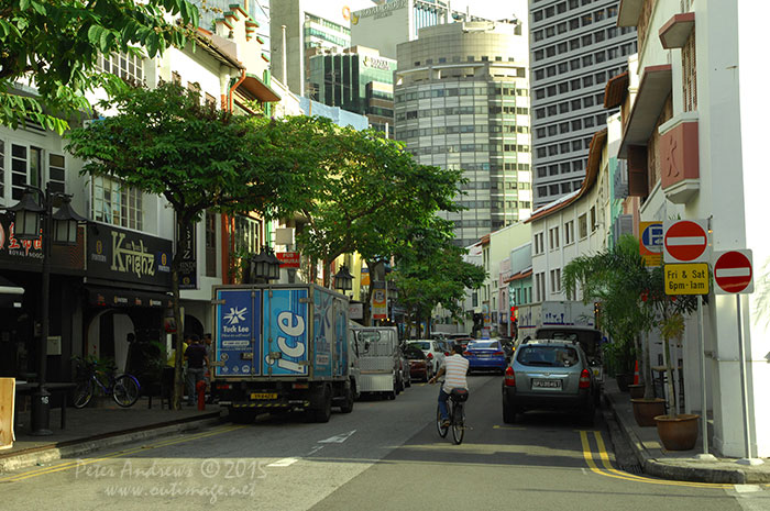 The evening view down Circular Road looking towards the buildings of Singapore's business district of Raffles Place. Photo &copy; Peter Andrews / Outimage. Walking from Circular Road to Chinatown in Singapore as the city prepares for the Lunar New Year.