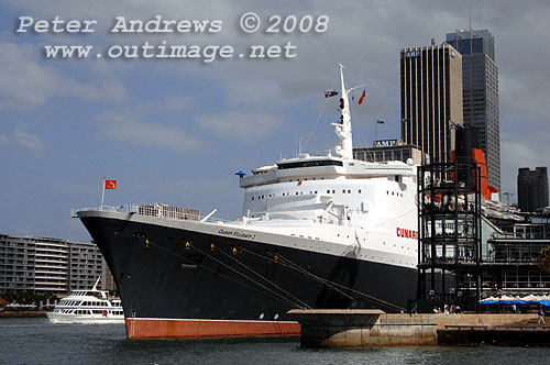 Queen Elizabeth 2 alongside at the Overseas Passenger Terminal, Circular Quay Sydney viewed from Campbells Cove.