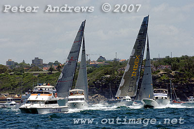 Mike Slade's 30 metre maxi City Index Leopard just ahead of Bob Oatley's Wild Oats approaching the inner mark at the heads.