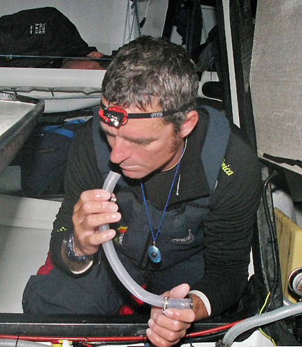 Pepe Ribes checking the water maker onboard Telefonica Blue. Many of the crew had become ill due what could have been rust found in the water maker. Photo copyright Gabriele Olivo / Telefonica Blue / Volvo Ocean Race. 