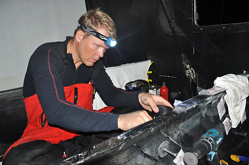 Caey Smith from Australia makes final repairs to the bow. The crew of PUMA Ocean Racing make repairs to their boat after sustaining serious structural damage in rough seas, for the second time in 24 hours. Photo © Rick Deppe / PUMA Ocean Racing / Volvo Ocean Race.