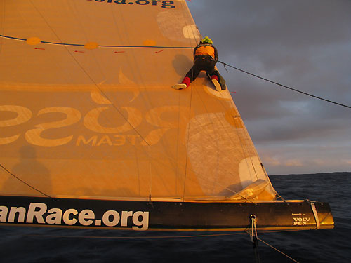 Ben Costello, fixing the mainsail onboard Team Russia, on leg 2 of the Volvo Ocean Race, from Cape Town, South Africa to Cochin, India. Photo copyright Mark Covell / Team Russia / Volvo Ocean Race.
