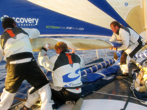 Skipper Chuny, bowman Ed van Lierde and boat captain Ed O'Conner catching the sail during a sail change, on leg 2 of the Volvo Ocean Race, from Cape Town, South Africa to Cochin, India. Photo © Sander Pluijm / Team Delta Lloyd / Volvo Ocean Race.
