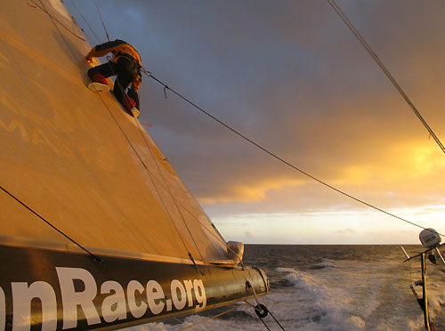 Ben Costello repairing the mainsail onboard Team Russia, on leg 2 of the Volvo Ocean Race, from Cape Town, South Africa to Cochin, India. Photo copyright Mark Covell / Team Russia / Volvo Ocean Race.