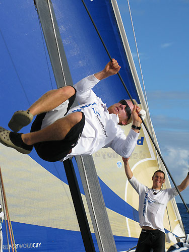Ed van Lierde doing a kitesurf 'tabletop' onboard Delta Lloyd, on leg 2 of the Volvo Ocean Race, from Cape Town, South Africa to Cochin, India. Morgan White appreciates it, Ed's hand is obviously getting better. Photo copyright Sander Pluijm / Team Delta Lloyd / Volvo Ocean Race.