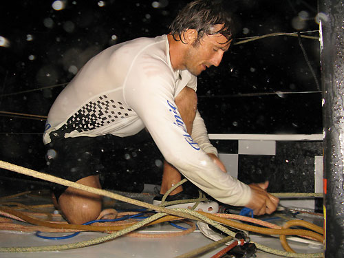 Javier de la Plaza getting soaked onboard Telefonica Black, in no wind, on leg 3 of the Volvo Ocean Race from India to Singapore. Photo � Mikel Pasabant / Telefonica Black / Volvo Ocean Race.