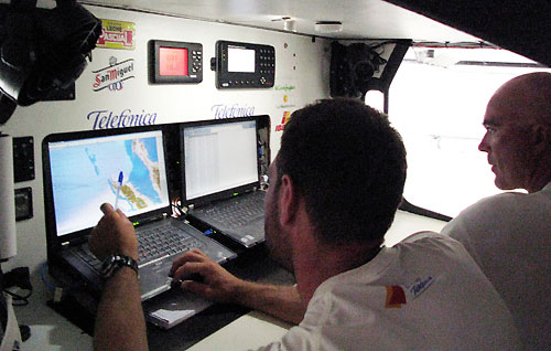 Navigator Simon Fisher and skipper Bouwe Bekking discuss their route after the scoring gate, onboard Telefonica Blue, on leg 3 of the Volvo Ocean Race from India to Singapore. Photo copyright Gabriele Olivo / Telefonica Blue / Volvo Ocean Race.