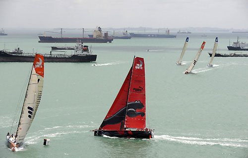 The start of leg 4 of the Volvo Ocean Race, from Singapore to Qingdao, China. In the background are some of the vast number of ships anchored outside this busy global maritime crossroad. Photo copyright Rick Tomlinson / Volvo Ocean Race.