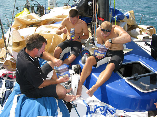 Time for lunch on deck, Stu Wilson left, Morgan White centre, Gerd-Jan Poortman onboard Team Delta Lloyd, while taking shelter in Salomique Bay, Philippines. Photo copyright Sander Pluijm / Team Delta Lloyd / Volvo Ocean Race.