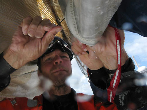 Bowman Martin Krite reefs the mainsail on Ericsson 3 en route to Rio De Janeiro on Leg 5 of the Volvo Ocean Race. Photo copyright Gustav Morin / Ericsson 3 / Volvo Ocean Race.