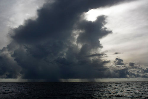 PUMA Ocean Racing on the horizon underneath huge rain clouds in the Doldrums, on leg 5 of the Volvo Ocean Race, from Qingdao to Rio de Janeiro. Photo copyright Gustav Morin / Ericsson 3 / Volvo Ocean Race.