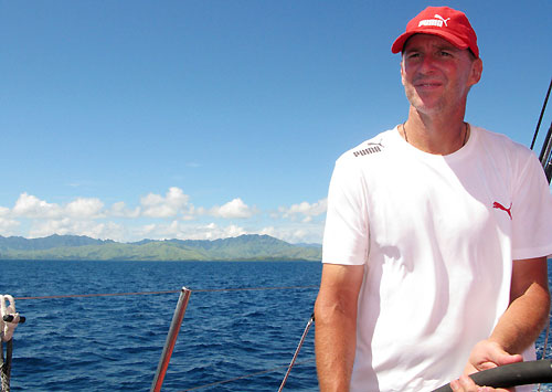 Skipper Ken Read helming onboard PUMA Ocean Racing with Fiji in the background, on leg 5 of the Volvo Ocean Race, from Qingdao to Rio de Janeiro. Photo copyright Rick Deppe / PUMA Ocean Racing / Volvo Ocean Race.