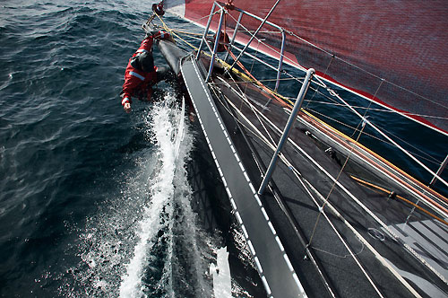 Casey Smith hanging off the bow (and I don't think he is there to clean his teeth! Ed), kind of onboard PUMA Ocean Racing, on leg 5 of the Volvo Ocean Race, from Qingdao to Rio de Janeiro. Photo copyright Rick Deppe / PUMA Ocean Racing / Volvo Ocean Race.