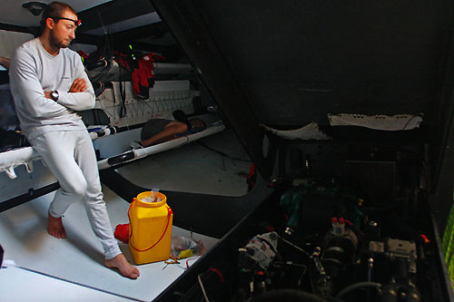 Andrew McLean looking in despair at thier broken generator, on leg 5 of the Volvo Ocean Race, from Qingdao to Rio de Janeiro. Photo copyright Guo Chuan / Green Dragon Racing / Volvo Ocean Race.