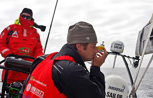 Navigator Ian Moore takes a bearing, onboard Green Dragon, on leg 7 from Boston to Galway. Photo copyright Guo Chuan / Green Dragon Racing / Volvo Ocean Race.