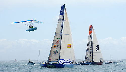 An ultralight Zodiac dinghy flys past Telefonica Blue, skippered by Bouwe Bekking (NED) at the start of leg 9 from Marstrand to Stockholm. (No surprise that someone from Sweden could come up with such a concept. It would have to be an interesting licensing arrangement however. Ed). Photo copyright Rick Tomlinson / Volvo Ocean Race.