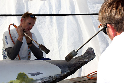 Telefonica shore crews work around the clock to fix the damage sustained when they ran aground at the start of leg 9. Photo copyright María Muina / Equipo Telefonica / Volvo Ocean Race.
