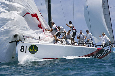 Ernesto Bertarelli's Alinghi during a spinnaker drop.