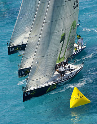 Giovanni Maspero's Joe Fly (ITA), Jim Richardson's Barking Mad (USA) and Vincenzo Onorato's Mascalzone Latino (ITA) rounding the windward mark. Photo copyright ROLEX Daniel Forster.