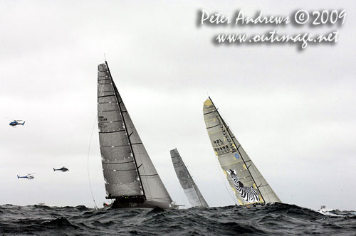 Maxis' and choppers lead the fleet outside Sydney Heads after the start of the Rolex Sydney Hobart 2009. Photo copyright Peter Andrews, Outimage Australia.