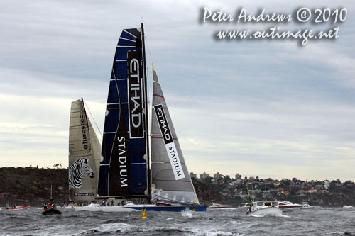 Grant Wharington&rsquo;s Melbourne 98 footer Wild Thing, slipping ahead of Sean Langman and Anthony Bell&rsquo;s Investec Loyal, after the start of the 2010 Rolex Sydney Hobart Yacht Race. Photo copyright Peter Andrews, Outimage Australia.