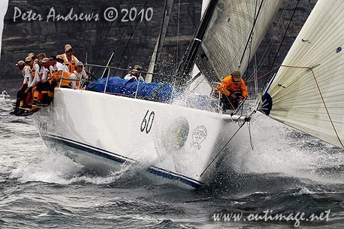 Grant Wharington and crew onboard the Maxi Wild Thing, outside the heads after the start of the Rolex Sydney Hobart 2010. Photo copyright Peter Andrews, Outimage Australia.