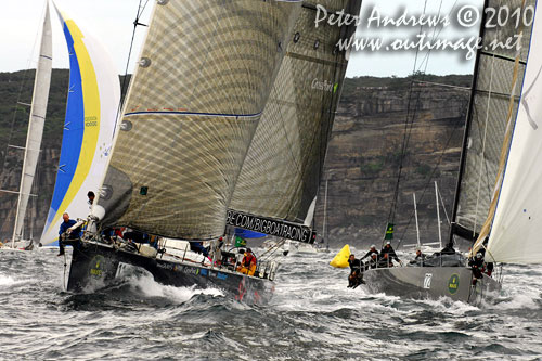 Ludde Ingvall's 90 foot maxi YuuZoo and Niklas Zennstr&ouml;m&rsquo;s R&aacute;n, outside the heads after the start of the Rolex Sydney Hobart 2010. Photo copyright Peter Andrews, Outimage Australia.