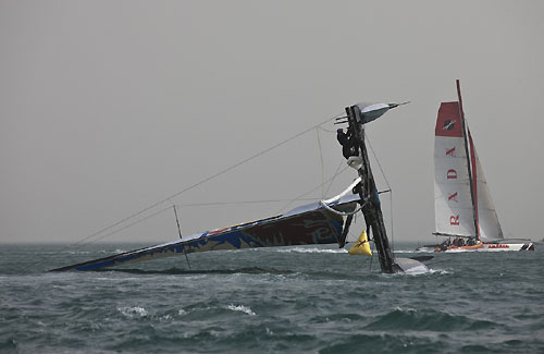 Team Red Bull Extreme Sailing capsizing on day 2 of racing, during the Extreme Sailing Series 2011, Qingdao, China. Photo copyright Lloyd Images.
