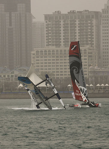 The Wave-Muscat mid-capsize in race 2 on day 3, during the Extreme Sailing Series 2011, Qingdao, China. Photo copyright Sui Zhi Qiang, Lloyd Images.