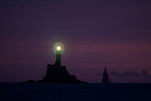 Passing Fastnet Rock at night, during the Rolex Fastnet Race 2011. Photo copyright Rolex and Daniel Forster.