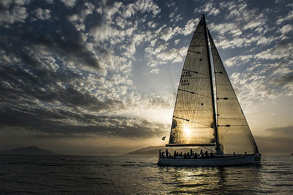 G�rard Logel's Arobas (FRA), is welcomed by the sunrise for her arrival to Capri to complete leg one of the Rolex Volcano Race 2012. Photo copyright Kurt Arrigo for Rolex.