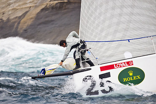The bowman at work on Marcelo Massa's Soto 40 Loyal (BRA) , during the Rolex Ilhabela Sailing Week 2011. Loyal (BRA) se prepara para subir o bal&atilde;o. Photo copyright Rolex and Carlo Borlenghi.