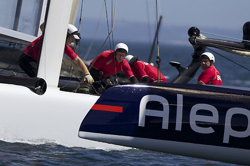 Charlie Ogletree's China Team look over at Bertrand Pac�s Aleph at the America's Cup World Series, Cascais, Portugal, August 6-14, 2011. Photo copyright Morris Adant.